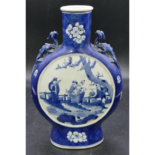 176 - An Oriental round bulbous flask shaped vase with raised inset handles on blue and white ground with ... 