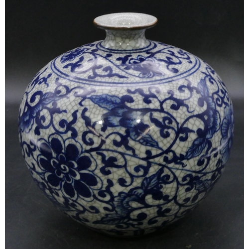 179 - A reproduction Oriental round bulbous thin necked vase of blue and white ground with floral, leaf an... 