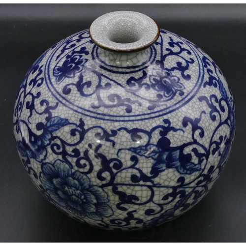 179 - A reproduction Oriental round bulbous thin necked vase of blue and white ground with floral, leaf an... 