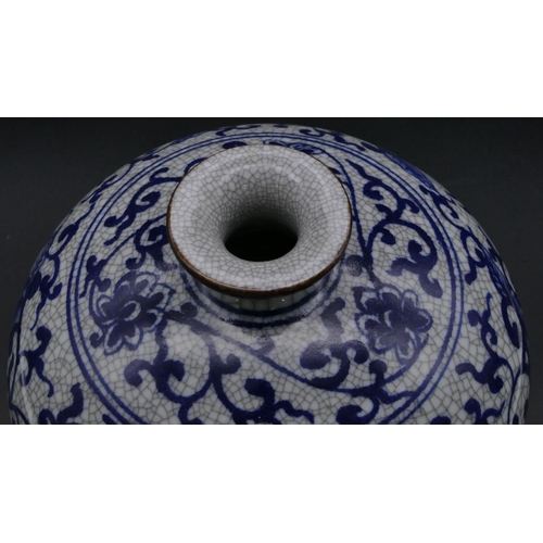 179 - A reproduction Oriental round bulbous thin necked vase of blue and white ground with floral, leaf an... 