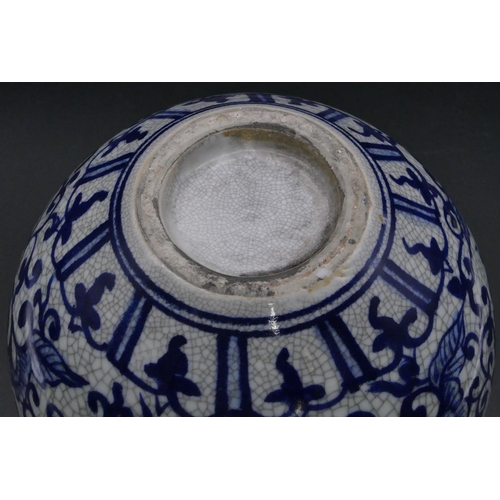 179 - A reproduction Oriental round bulbous thin necked vase of blue and white ground with floral, leaf an... 