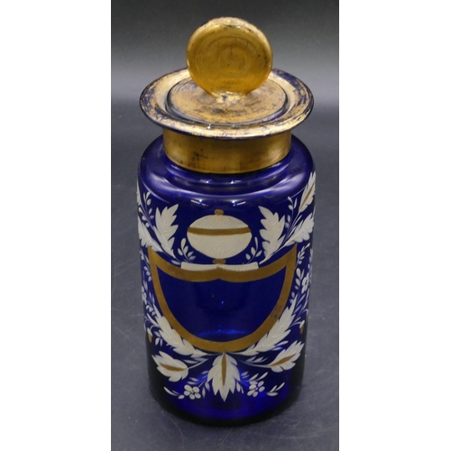 180 - A Bristol blue glass medicine bottle with stopper and raised white and gilt floral and acorn decorat... 