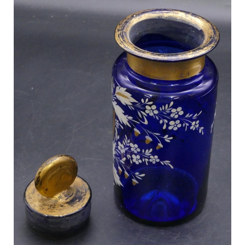 180 - A Bristol blue glass medicine bottle with stopper and raised white and gilt floral and acorn decorat... 