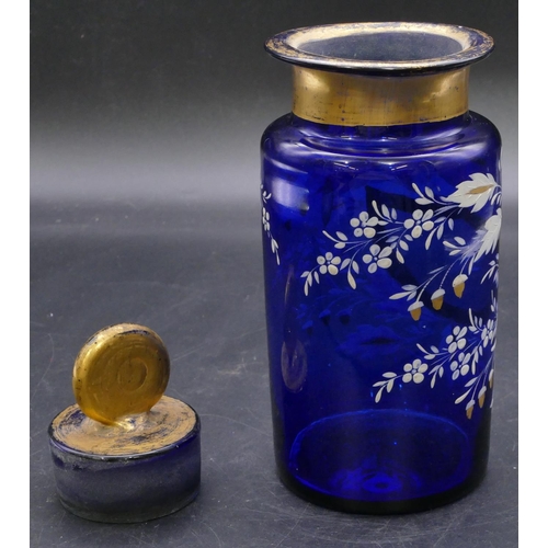 180 - A Bristol blue glass medicine bottle with stopper and raised white and gilt floral and acorn decorat... 