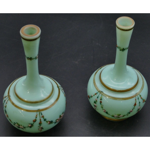 181 - A pair of 19th Century opaline glass round bulbous thin necked vases on green ground with hand paint... 