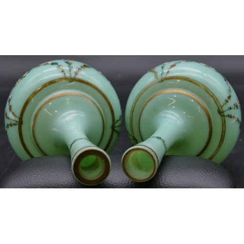 181 - A pair of 19th Century opaline glass round bulbous thin necked vases on green ground with hand paint... 