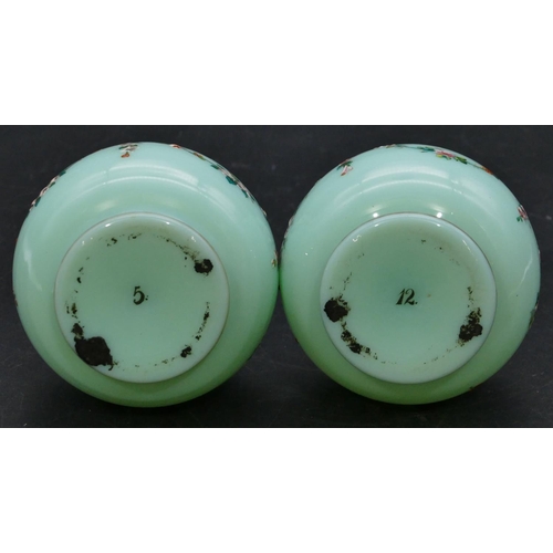 181 - A pair of 19th Century opaline glass round bulbous thin necked vases on green ground with hand paint... 