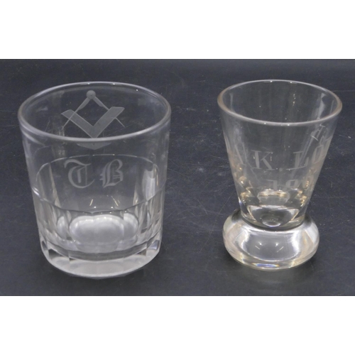 193 - A Masonic clear glass tumbler with engraved Masonic and initials, 8.7cm high and a Masonic round cle... 