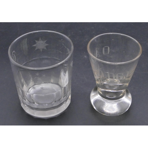 193 - A Masonic clear glass tumbler with engraved Masonic and initials, 8.7cm high and a Masonic round cle... 