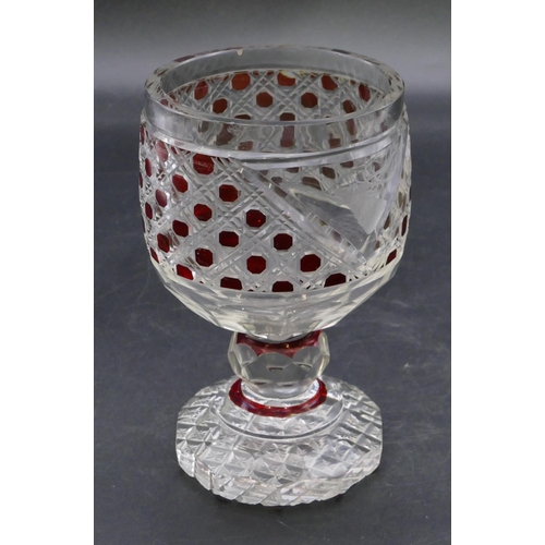 194 - A ruby and clear cut glass round trumpet shaped tumbler with engraved stags head motif on bulbous st... 