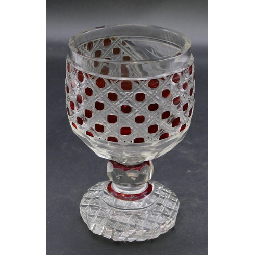 194 - A ruby and clear cut glass round trumpet shaped tumbler with engraved stags head motif on bulbous st... 