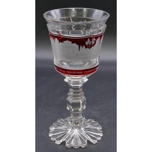 195 - A clear and ruby round trumpet shaped drinking glass with etched panel 