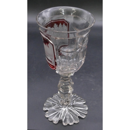 195 - A clear and ruby round trumpet shaped drinking glass with etched panel 