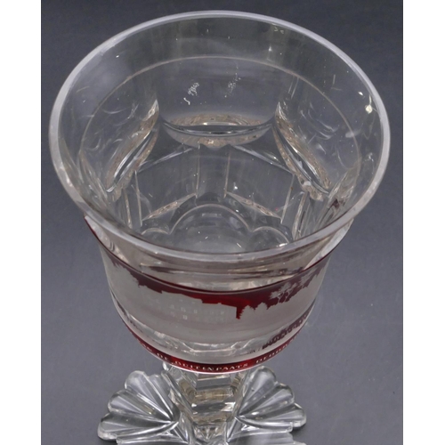 195 - A clear and ruby round trumpet shaped drinking glass with etched panel 