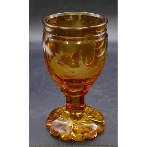 196 - An amber glass round bulbous shaped tumbler with etched figure decoration 