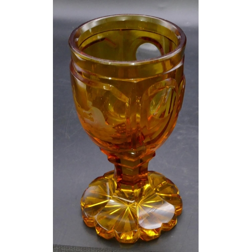 196 - An amber glass round bulbous shaped tumbler with etched figure decoration 