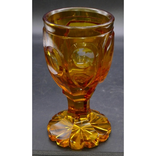 196 - An amber glass round bulbous shaped tumbler with etched figure decoration 