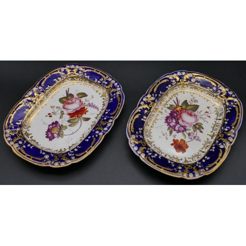 197 - A pair of 19th century rectangular shaped serving plates on white and blue ground with multicoloured... 