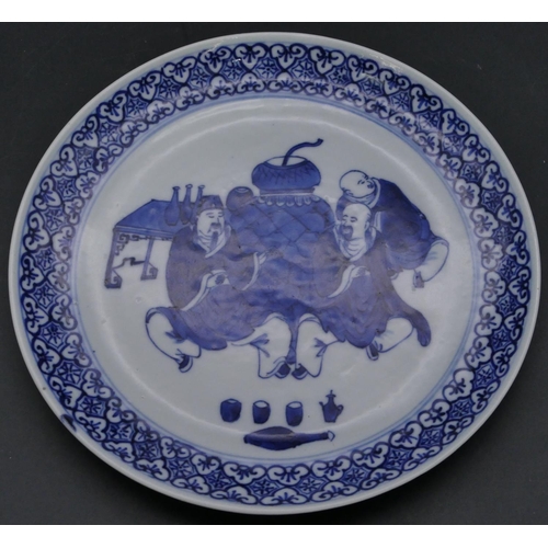 198 - A 19th Century Chinese small round plate on blue and white ground depicting 3 seated figures with sc... 