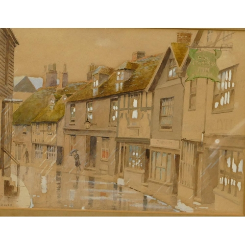 255 - PCC Davis watercolour and gouache street scene in the rain, signed, in black frame, 16 x 22cm.