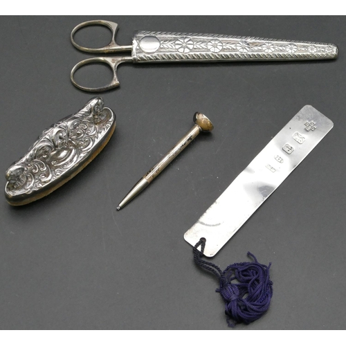 277 - A Birmingham silver nail buff, a Birmingham silver scissor case with embossed decoration, a modern B... 