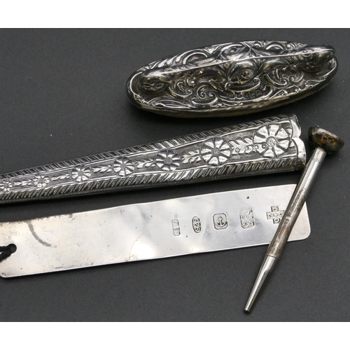 277 - A Birmingham silver nail buff, a Birmingham silver scissor case with embossed decoration, a modern B... 