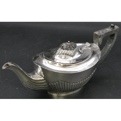 284 - A Birmingham small silver oval teapot with half embossed reeded decoration, ebonised handle and fini... 