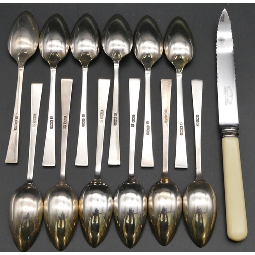 289 - A set of 12 silver grapefruit spoons (with plated knife) in fitted brown leather case, makers mark C... 