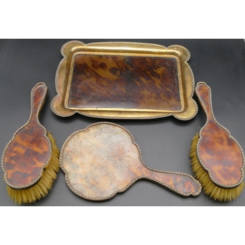 290 - A George V 4-piece silver gilt and tortoiseshell dressing table set comprising rectangular scallop s... 