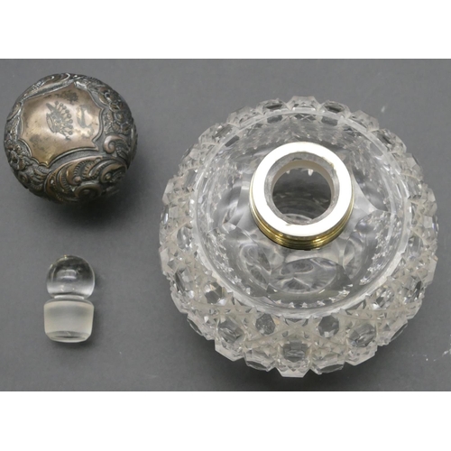 293 - A cut glass round bulbous shaped scent bottle with Birmingham silver screw lid with embossed decorat... 