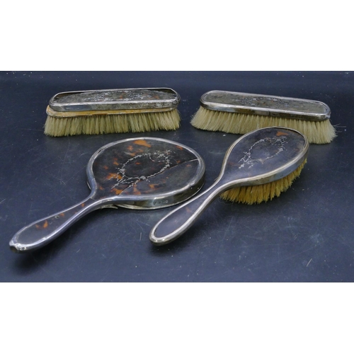 299 - A 4-piece London silver and tortoise shell dressing table set, 1 hand mirror and 3 brushes (all a/f)... 