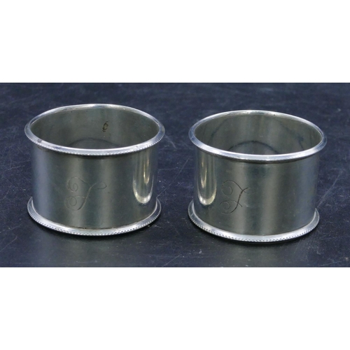 305 - A pair of Birmingham silver round napkin rings, 1.7oz. (2)