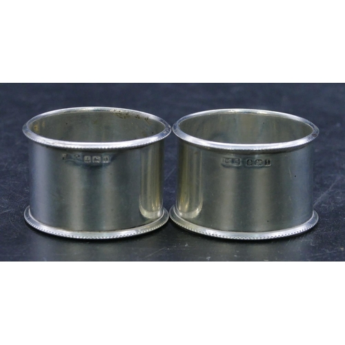 305 - A pair of Birmingham silver round napkin rings, 1.7oz. (2)