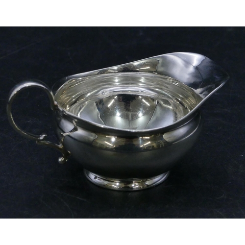 310 - A Birmingham silver small round bulbous shaped cream jug, 1.3oz.