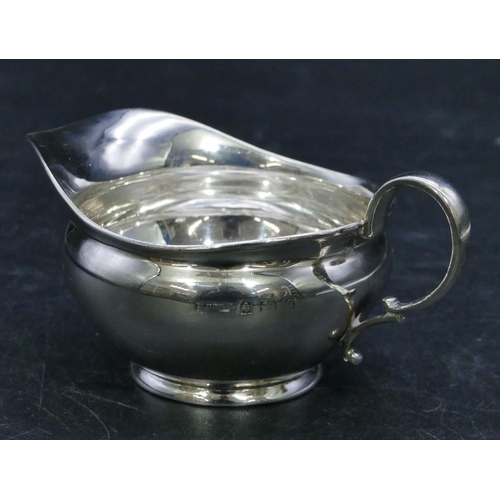 310 - A Birmingham silver small round bulbous shaped cream jug, 1.3oz.