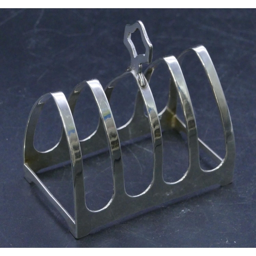 311 - A Sheffield silver 5-bar toast rack with centre carrying handle, 7.5cm long, 1.7oz.