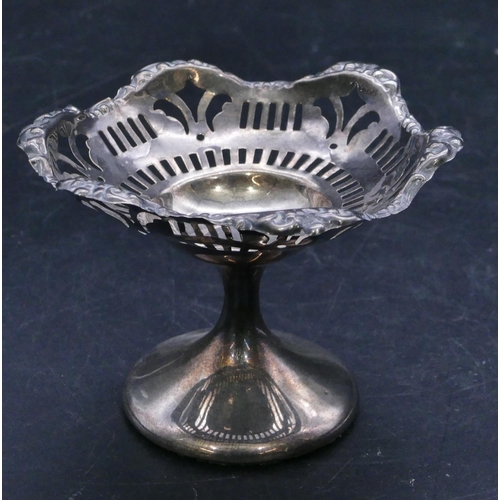 312 - A Birmingham silver scallop shaped small sweetmeat dish with embossed and pierced decoration on roun... 