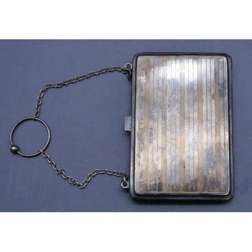 322 - A Birmingham silver mounted rectangular shaped purse with chain and engine turn decoration, hinged f... 