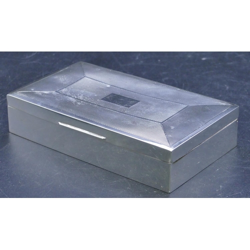 323 - A Birmingham silver rectangular shaped cigarette box with engine turned hinged lid, makers mark R.Br... 