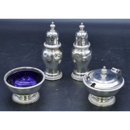 325 - A Garrard & Co Ltd 4-piece London silver round bulbous shaped condiment set, 2 pepper pots (both den... 