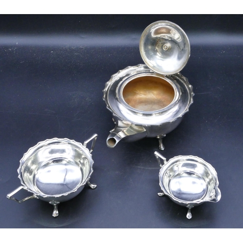 329 - A George V 3-piece round bulbous shaped tea service with crinkled rims on splayed feet, 1 teapot wit... 