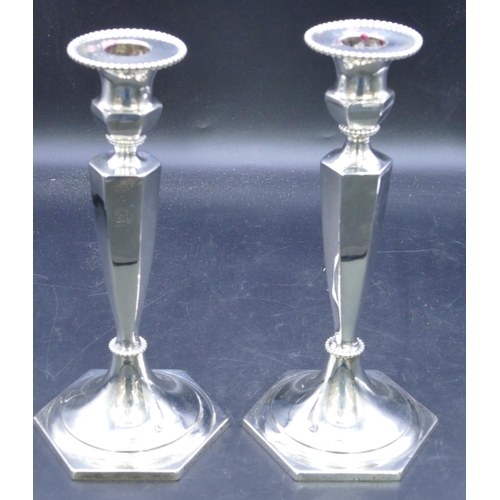 331 - A pair of Edward VII hexagonal silver candlesticks on turned stems with sweeping bases, Birmingham 1... 