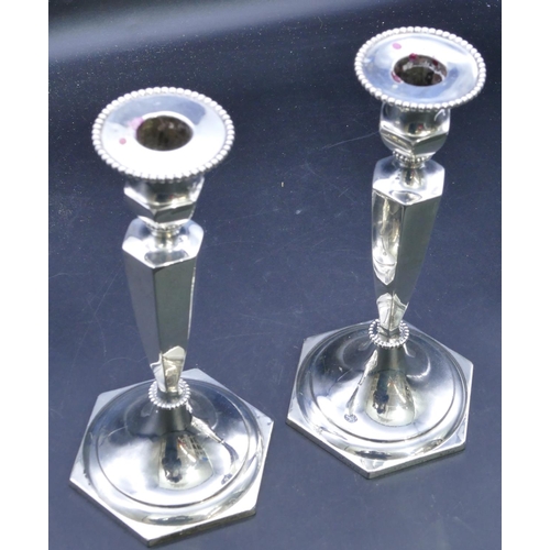 331 - A pair of Edward VII hexagonal silver candlesticks on turned stems with sweeping bases, Birmingham 1... 