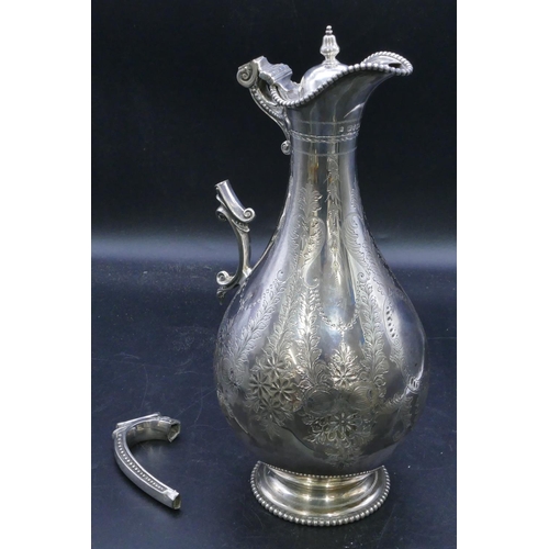 334 - A Victorian silver round bulbous thin necked water jug with all over raised ball rims, engraved flor... 