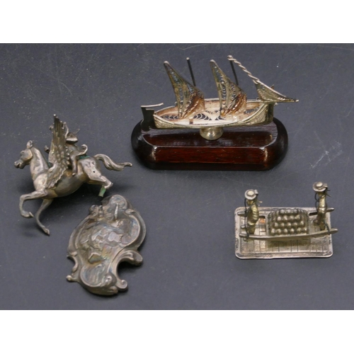 337 - A Sterling silver small model of a ship on hardwood stand and 2 other silver coloured metal small gr... 