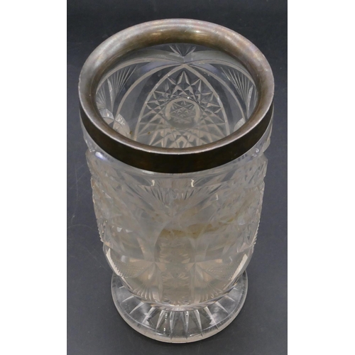 340 - A heavy cut glass cylindrical vase with London silver neck, on round sweeping foot, 18cm high.