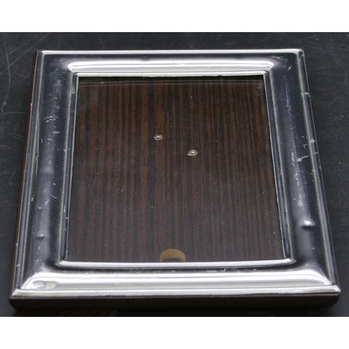 344 - A modern 925 plain silver freestanding photograph frame (some small dents), 16.7cm high overall.