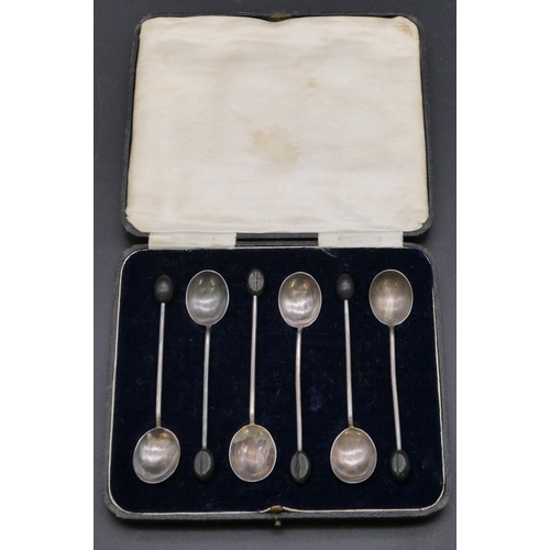 349 - A set of 6 Sheffield silver coffee bean spoons in fitted leather case, 1.1oz.