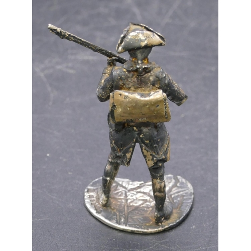 358 - A London silver miniature figure of a military gentleman, 1.4oz, 6cm high.