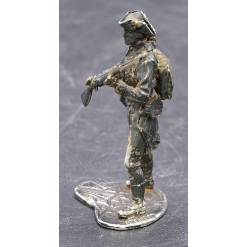 358 - A London silver miniature figure of a military gentleman, 1.4oz, 6cm high.